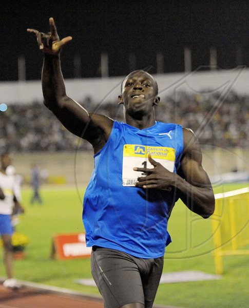 Ian Allen/Photographer
Usain Bolt celebrates winning the men's 200 metres at the JN Jamaica International Invitational track meet, at the National Stadium on Saturday night. Bolt won in19.56 seconds..