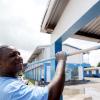 Ricardo Makyn/Staff Photographer
Mark Hamilton, a member of the Linstead and Bog Walk Taxi Association, paints a section of the Linstead Primary and Junior High School in St Catherine on Monday, Labour Day.

 May  on Monday 25.5.2009.