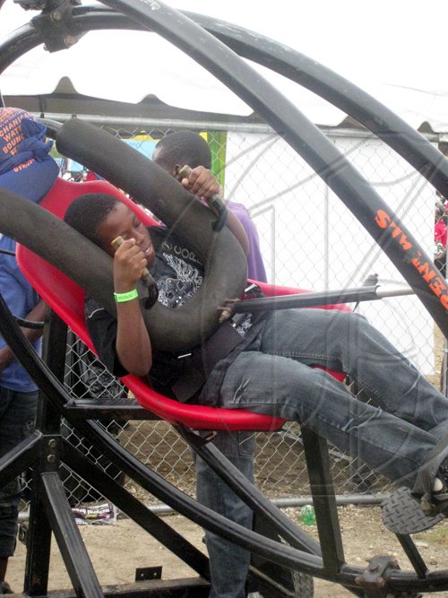 Mel Cooke photo

Leaning over and over, he will soon be upside down on this ride!