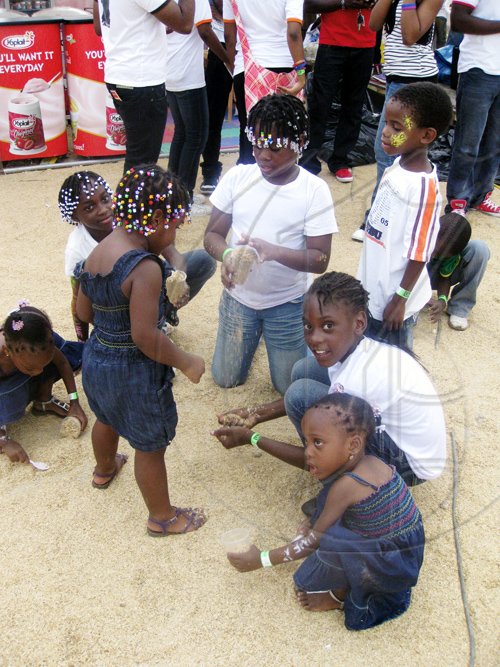 Mel Cooke photo

The sawdust was meant to make the walk through the venue more comfortable, but these children made it into part of the fun at Skool Aid.