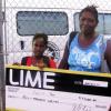 Mel Cooke photo

Eight year-old Trishay Johns (left) and her mother Marlene Jones with the scholarship cheque