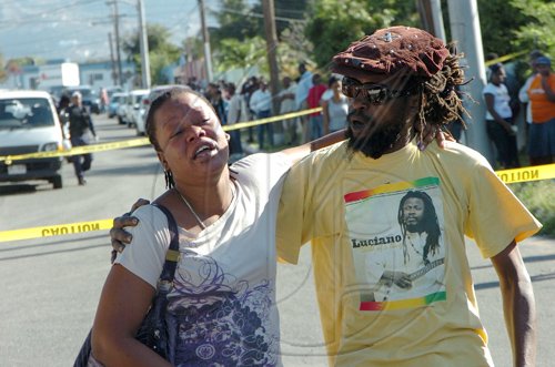 Rudolph Brown/Chief Photographer
One of Luciana baby mother crying for her daughter after a two hour shoot out at the artiste's home with a lone gunman, three policemen were shot and injured at Westminster Crescent in St. Andrew on Wednesday, March 25-2009