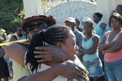 Rudolph Brown/Chief Photographer
One of Luciana baby mother crying for her daughter after a two hour shoot out at the artiste's home with a lone gunman, three policemen were shot and injured at Westminister Crescent in St. Andrew on Wednesday, March 25-2009