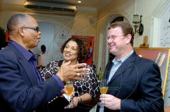 Winston Sill / Freelance Photographer
The always energetic Alva Anderson (left) raps with J. Wray and Nephew's Master Blender Joy Spence and Managing Director for Production Paul Henriques.

Appleton Estate host Dinner and Tasting of Luxury Rum, held at Terra Nova All-Suite Hotel, Waterloo Road on thursday night November 19, 2009.