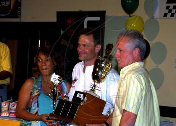 Winston Sill / Freelance Photographer
AUTO FEATURE:----Jamaica Race Drivers Club (JRDC) Awards Presentation Functyion, held at the Jamaica Pegasus Hotel, New Kingston on Friday night April 9, 2010. Here are Andrea Morgan (left), Area Manager, Total; David Summerbell Jr. (centre); and Gordon Craig (right), Managing Director, Total.