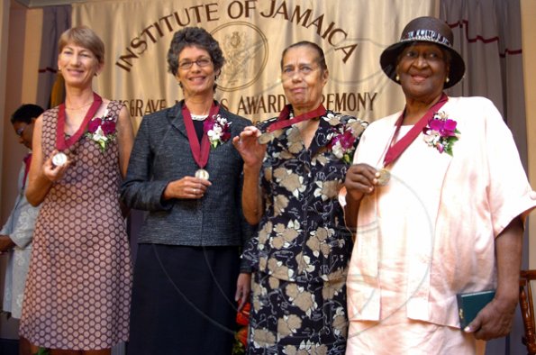 Peta-Gaye Clachar/Freelance Photographer
Musgrave Bronze medal awardees (from left to right) Ms. Wendy Lee was awarded for her contribution to Environmental Conservation, Ms. Diana McCaulay also for her contribution to Environmental Conservation, Mrs. Marguerite Vernon her music and Mrs. Rhona welsh for needlecraft shares the spotlight at the Institute of Jamaica (IOJ) Musgrave Awards ceremony at IOJ on Wednesday, October 14, 2009.