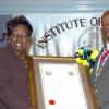 Peta-Gaye Clachar/Staff Photographer
Minister Youth Sports and Culture Olivia 'Babsy' Grange present a citation after presenting the Musgrave Gold Medal to Colonel Sidney Peddi  for his contribution to the Maroons at the Institute of Jamaica Musgrave Medals Awards Ceremony at the Institute of Jamaica on Thursday, May 28, 2009.