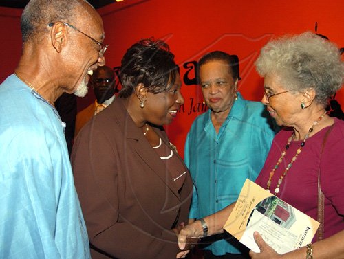 Peta-Gaye Clachar/Staff Photographer
Minister Youth Sports and Culture Olivia 'Babsy' Grange greets Jean Smith (right) as Dr. the Honourable Barbara Gloudon Deputy Chairman of the Council at the Institute of Jamaica and Professor Barry Chevannes (left) Chairman of the Councill of the Institute of Jamaica looks on while at the Institute of Jamaica Musgrave Medals Awards Ceremony at the Institute of Jamaica on Thursday, May 28, 2009.