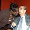 Peta-Gaye Clachar/Staff Photographer
Minister of Youth and Culture Olivia 'Babsy' Grange (left) gives a birthday kiss to former Prime Minister of Jamaica  the Right Honourable Edward Seaga celebrating his 79th birthday when he attended the Institute of Jamaice Musgrave Medals Awards Ceremony at the Institute of Jamaica on Thursday, May 28, 2009.