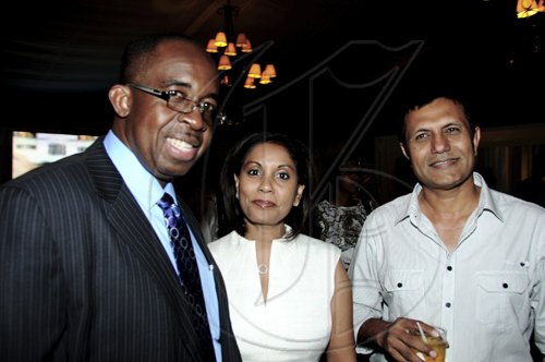 Winston Sill / Freelance PhotographerGroup Managing Director of National Commercial Bank (NCB) Patrick Hylton (left) and the bank's Assistant General Manager, Retail Banking Bernadette Barrow lyme with Carland Investments Managing Director Tariq Malik at the NCB Auto Dealers Awards Ceremony, held at Terra Nova All-Suite Hotel, Waterloo Road on Tuesday night.*************************************************************************** April 5, 2011.
