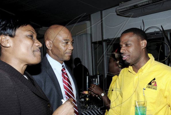 Winston Sill / Freelance Photographer
Jermaine Blair (right) loans co-ordinator at Crichton Automotive, raps with Dennis Cohen, deputy group managing director of National Commercial Bank and Audrey Tugwell-Henry, senior general manager, Retail Banking at NCB.

*************************************************************
 Auto Dealers Awards Ceremony, held at Terra Nova All-Suite Hotel, Waterloo Road on Tuesday night April 5, 2011.