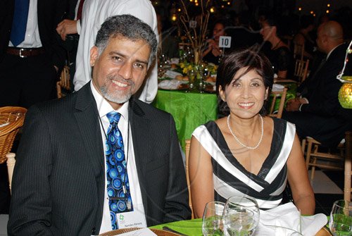 Janet Silvera Photo
Pioneers of Prosperity finalist, Trinidad and Tobago's Analytical Technologies CEO, Namdeo Maharaj share the spotlight.

*****************************************************************************poses for the camera with his competitor's wife, Kamla Maharaj at Pioneers awards ceremony at the Half Moon in Montego Bay last Friday night.
