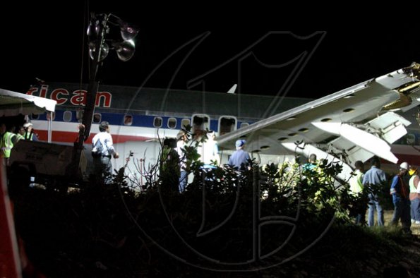 Winston Sill / Freelance Photographer
Removal of crash American Airlines aircraft from the crash site, off Port Royal Road, on Monday night December 28, 2009. Winston Sill / Freelance Photographer
Removal of the middle section of the  crashed  American Airlines aircraft from the crash site, off Port Royal Road, on Monday night December 28, 2009.