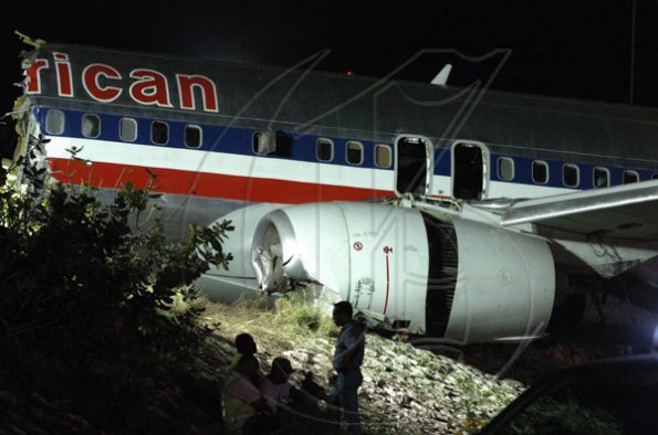 Winston Sill / Freelance Photographer
Removal of crash American Airlines aircraft from the crash site, off Port Royal Road, on Monday night December 28, 2009. Winston Sill / Freelance Photographer
Removal of the middle section of the  crashed  American Airlines aircraft from the crash site, off Port Royal Road, on Monday night December 28, 2009.