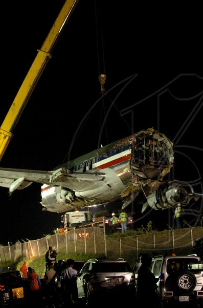 Winston Sill / Freelance Photographer
Removal of crash American Airlines aircraft from the crash site, off Port Royal Road, on Monday night December 28, 2009. Winston Sill / Freelance Photographer
Removal of the middle section of the  crashed  American Airlines aircraft from the crash site, off Port Royal Road, on Monday night December 28, 2009.