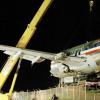 Winston Sill/Freelance Photographer
The middle section of American Airlines Flight 331is removed, on Monday night, from the site at which it came to stop after it overshot the runway at the Norman Manley International Airport in Kingston last week.