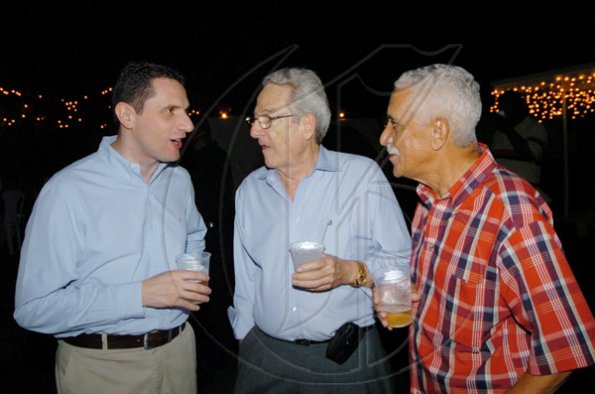 Winston Sill / Freelance Photographer
Digicel Jamaica's Jason Corrigan (left) talks business with the jolly fellows Peter Bangerter (centre) and Col. Trevor MacMillan.

PRO Comm Christmas Party, held at Kingsway on Saturday night December 5, 2009.