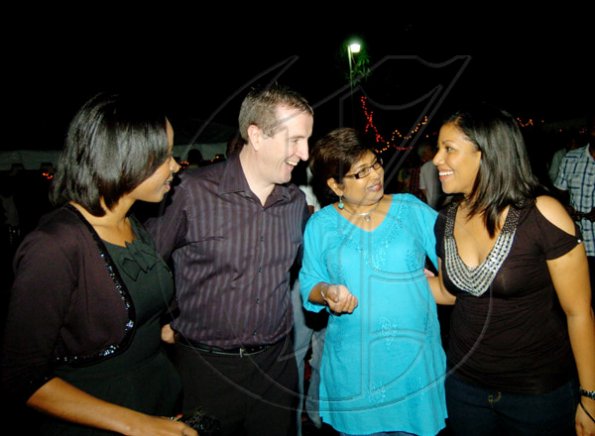 Winston Sill / Freelance Photographer
The first lady of PROComm, Jean Lowrie-Chin (second right) jokes with Lisa Chin (right) of Lasco, as well as Digicel Jamaica boss Mark Linehan and wife Leisha.
 Christmas Party, held at Kingsway on Saturday night December 5, 2009.