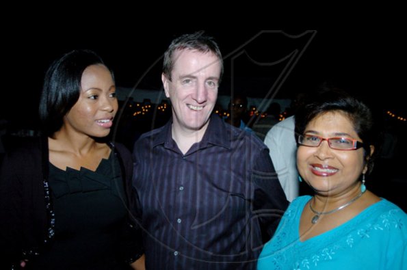 Winston Sill / Freelance Photographer
Jean Lowrie-Chin (right) welcomes Digicel Jamaica boss Mark Linehan and wife Leisha to the party.

PRO Comm Christmas Party, held at Kingsway on Saturday night December 5, 2009.