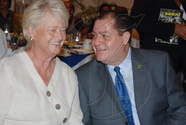 Janet Silvera Photo
 
From L- Fresh from his trip to Turkey, Minister of Finance and the Public Service, Audley Shaw gets the attention of Rose Development's Michele Rollins during the PSOJ and Corporate Connections Chairman's Forum breakfast at the Hilton Rose Hall Resort and Spa in Montego Bay on Tuesday morning.