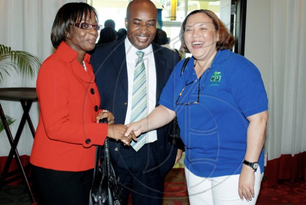 Janet Silvera Photo
 
From left: Jamaica Money Market Brokers' Lorna Hall and Roger Williams greet Caribbean Producers Jamaica (CPJ) Limited's Jan Polack at the PSOJ/Corporate Connections Chairman's Forum breakfast at the Hilton Rose Hall Resort and Spa in Montego Bay on Tuesday morning.