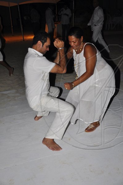 Janet Silvera Photo
 
Getting down low, Hiro Uttam from Barbados (left) and Sonia Ingleton at Rajeesh Kripalani at Cornwall Beach in Montego Bay last Saturday night.