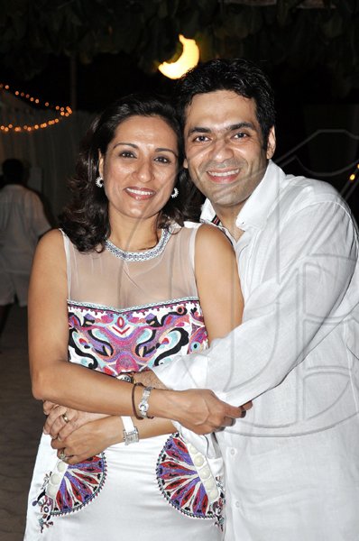 Janet Silvera
Love is the in air! Birthday boy, Rajeesh Kripalani cuddles up with wife Neha at his 40th birthday party at Cornwall Beach in Montego Bay last Saturday night.