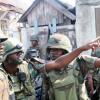 Norman Grindley /Chief Photographer
These Jamaica Defence Force soldiers point to the direction guns shots come from during an operation in West Kingston on Monday.
