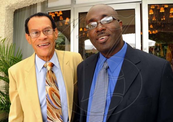 Rudolph Brown/Photographer
Don Topping, (left) chat with Gary Allen, Managing Directon of RJR Group at RJR 60th Anniversary long service awards luncheon at the Terra Nova Hotel in Kingston on Friday, July 9-2010.