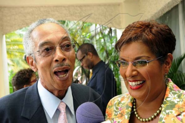 Rudolph Brown/Photographer
Dorraine Samuel-Binger chat with Alan Magnus at RJR 60th Anniversary long service awards luncheon at the Terra Nova Hotel in Kingston on Friday, July 9-2010.