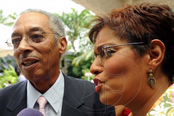 Rudolph Brown/Photographer
Dorraine Samuel-Binger chat with Alan Magnus at RJR 60th Anniversary long service awards luncheon at the Terra Nova Hotel in Kingston on Friday, July 9-2010.