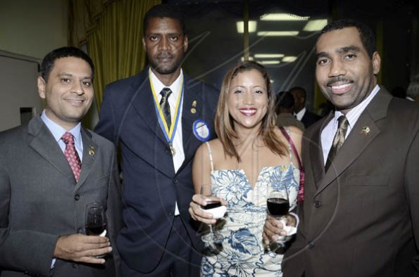 Rudolph Brown/Photographer
Christy Almeida (second right), is flanked by Haresh Ramchandani, Donovan G. Brown, and Audley Knight at  The Rotary Club of St Andrew North's 25th annual installation ceremony at the Wyndham Hotel in New Kingston on Monday, June 27, 2011.