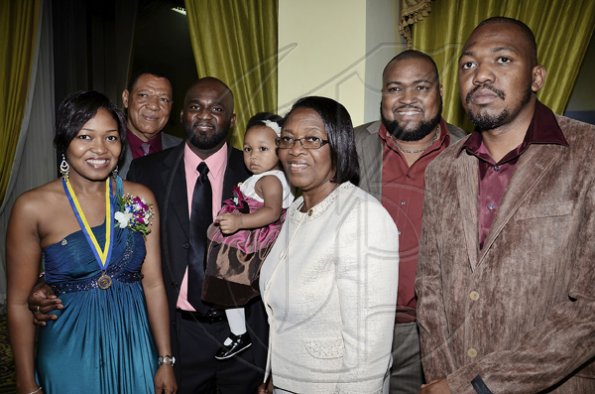Rudolph Brown/Photographer
Newly-installed president Kamieka Fullerton-DeLisser (left), poses with her family at her installation on June 27, 2011. From left are: father, Clifton Fullerton; husband, Jeremy DeLisser; baby, Lauren DeLisser; mother, Jennifer Althea Fullerton; Boyd Fullerton and Migu Fullerton.



 The Rotary Club of St. Andrew North 25th annual installation ceremony at the Wyndham Hotel in New Kingston on Monday, Jnue 27-2011