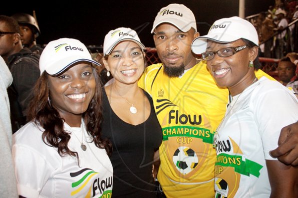 Contributed
The Flow family was out in full force at Flow's Champion Cup Finals on Sunday. (From left) Nova Hamilton, Denise Williams, Trace Gayle, and Simone Riley wear their corporate gear with flair!
