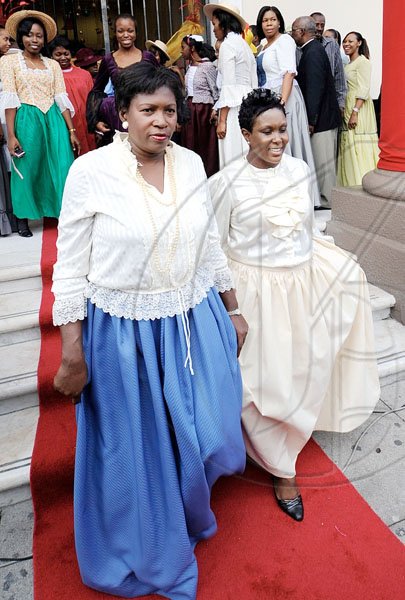 Rudolph Brown/Photographer
Jenniffer Brown (left) and Racquel Lowe of Scotiabank step onto the red carpet during the Scotiabank Jamaica celebration. 


****************************************************************************120years in Jamaica from 1889 to 2009 at the Kings Street Branch on Monday, December 14-2009