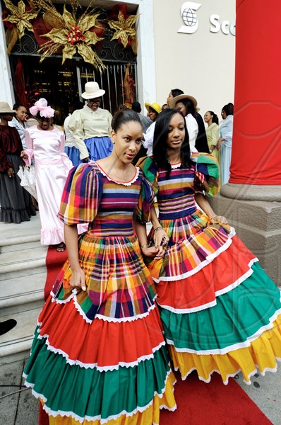 Rudolph Brown/Photographer
Tamico Briscoe (left) and Sophia Fyffe, members of the Scotiabank in national costume.

******************************************************************************************of Scotiabank walk on the red carpet during the Scotiabank Jamaica celebrating 120years in Jamaica from 1889 to 2009 at the Kings Street Branch on Monday, December 14-2009