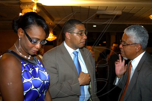 Winston Sill / Freelance Photographer
Launch of Edward Seaga book- "My Life And Leadership, volume one: Clash of Ideologies,1930--1980", held at Mona Visitor's Lodge, UWI Campus on Wednesday March 3
, 2010. Here are Mrs Holness (left); Andrew Holness (centre); and Prof. E. Nigel Harris (right).