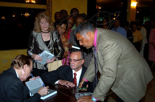 Winston Sill / Freelance Photographer
Launch of Edward Seaga book- "My Life And Leadership, volume one: Clash of Ideologies,1930--1980", held at Mona Visitor's Lodge, UWI Campus on Wednesday March 3
, 2010. Here book signing by Seaga.