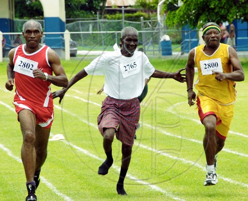 Norman Grindley/Chief Photographer
Three senior citizens compete in a race during senior citizens' sports day held at Jamaica College on Old Hope Road, St Andrew.