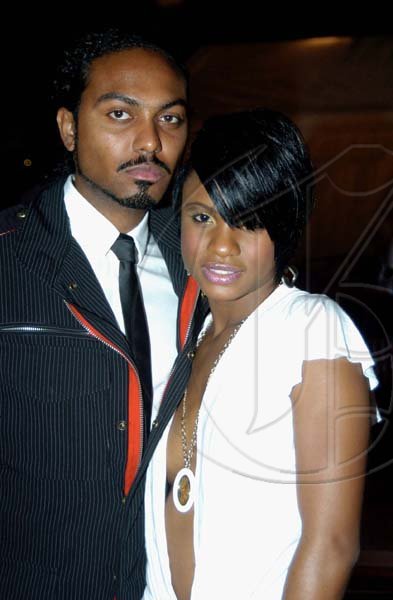 Winston Sill / Freelance Photographer
Caresa Peake (left) looking very sassy in her white dress with a plunging neckline and so is Krian Scott in his pin striped jacket suit, white shirt and black tie at the Shaggy and Friends show. 








*******************************************************
Shaggy Foundation presents "Shaggy and Friends 2010  Concert", held on the lawns of Jamaica House, Hope Road on Saturday night January 2, 2010.