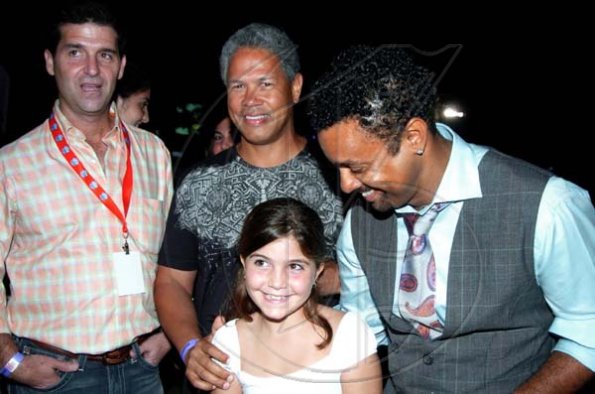 Winston Sill / Freelance Photographer
Shaggy (right) enjoying the company of little Mia Mahfood's (centre) while her father, William Mahfood (left) and Donovan Perkins looks on. 





Shaggy Foundation presents "Shaggy and Friends 2010  Concert", held on the lawns of Jamaica House, Hope Road on Saturday night January 2, 2010.