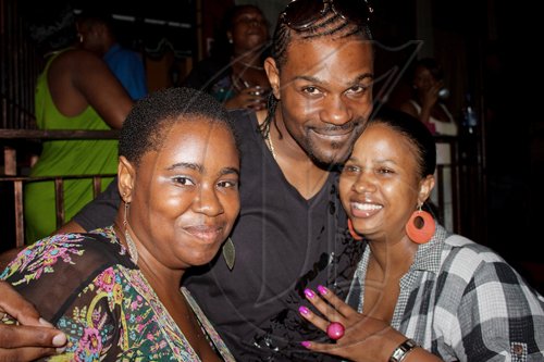 Singer D-Major (centre) shows some "Real Friends" love to (from left) Tamina-Shimone Green and Monique Matheson at Allstar Thursdays.