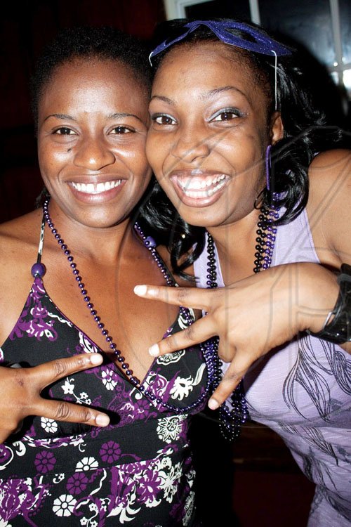Renena Wright (right) and Madeline Green show us they're single and ready to mingle at the mardi-gras themed edition of the singles lyme, 'Village Fever', held last Friday at Village Blues Bar.