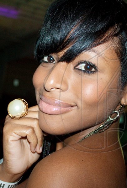 Showing off one of her favourite accessories, N'Gina Thompson is perfectly chic at 'YUSH'.
