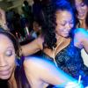 Bathed in electric blue from the overhead strobes, these ladies celebrate the return of 'The Fantastic Mega-Club YUSH' to the National Indoor Sports Centre last Saturday.