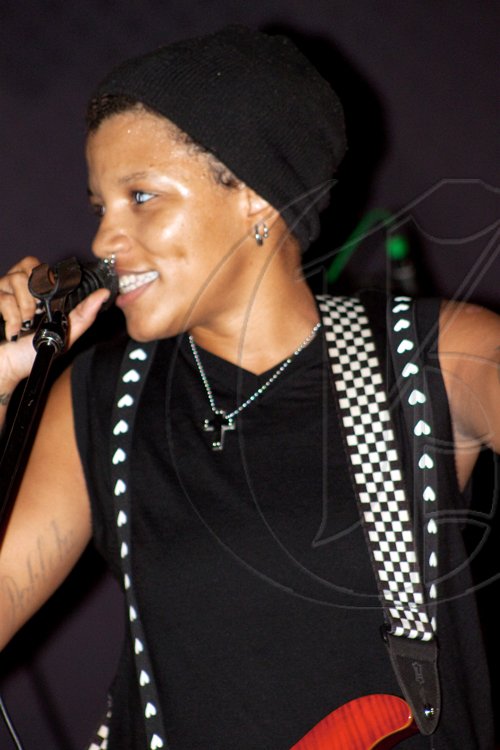 Decked out in heart-print suspenders befitting the name of the show, Katherine Williams of Crimson Heart Replica takes the stage as the headline performer at 'Love & Lazers' at Red BOnes Blues Café.