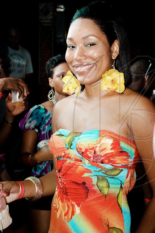 With orchid earrings complimenting a tropical print tube dress, Shanette Graham brought floral chic to the festivities at party Absinthe: Sunset Vista.