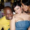 You've got quite a handful there sir! Marlon Campbell shows he's more than man enough to handle beauties Marsha Robotham(centre) and Dawnett Johnson at party Absinthe: Sunset Vista.