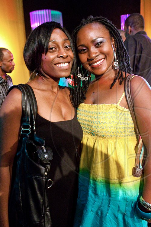 These two lovelies show off their patriotic black, green and gold spirit at the JCDC Jamaica Festival Launch.