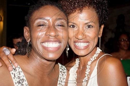 Kim-Marie Spence (left) matches smiles with Charl Baker at 'No-Maddz Live'.